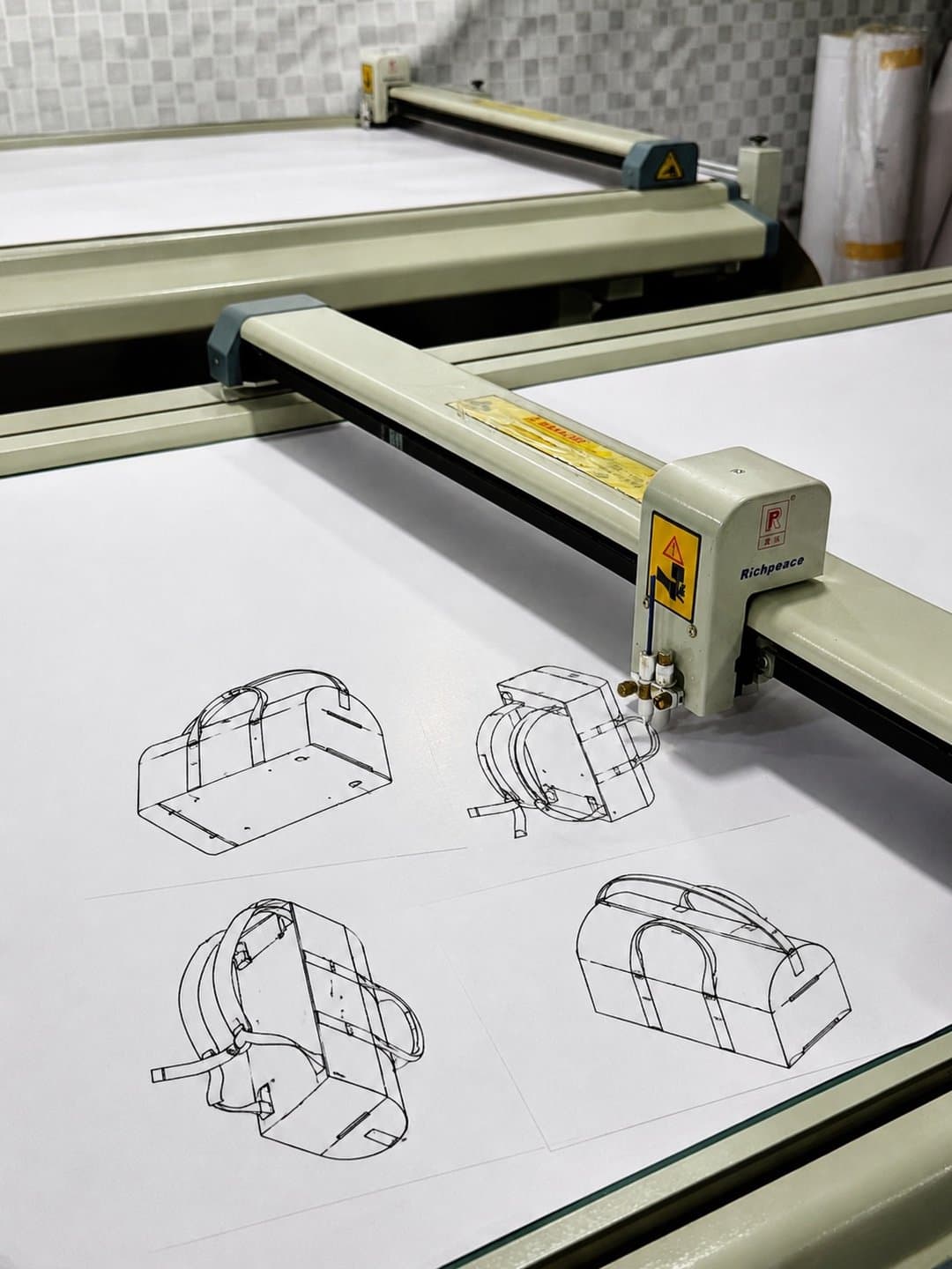 Pattern pieces for the weekender laid out on a digital cutting table